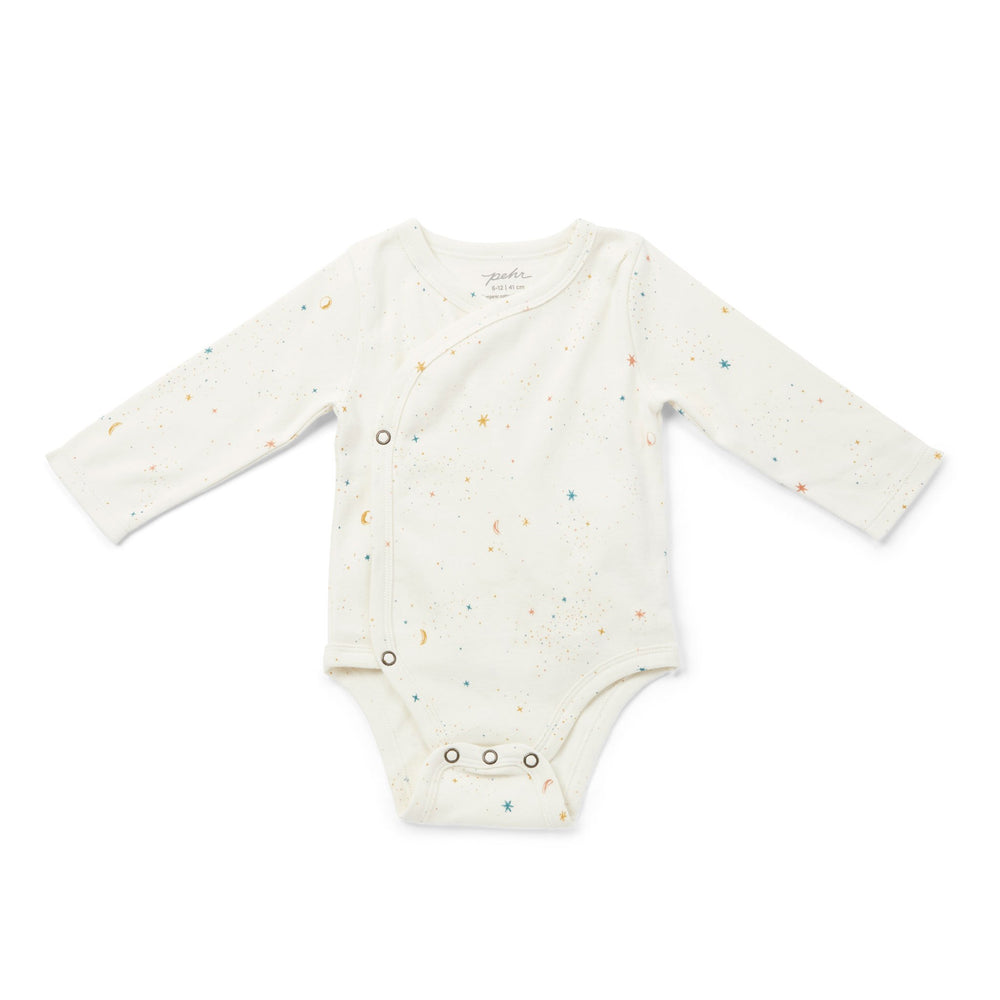 Pehr Celestial Organic One-Piece, Long Sleeve. GOTS Certified Organic Cotton & Dyes. White with celestial pattern, long sleeve, ruffles on shoulders, button closure at bottom.