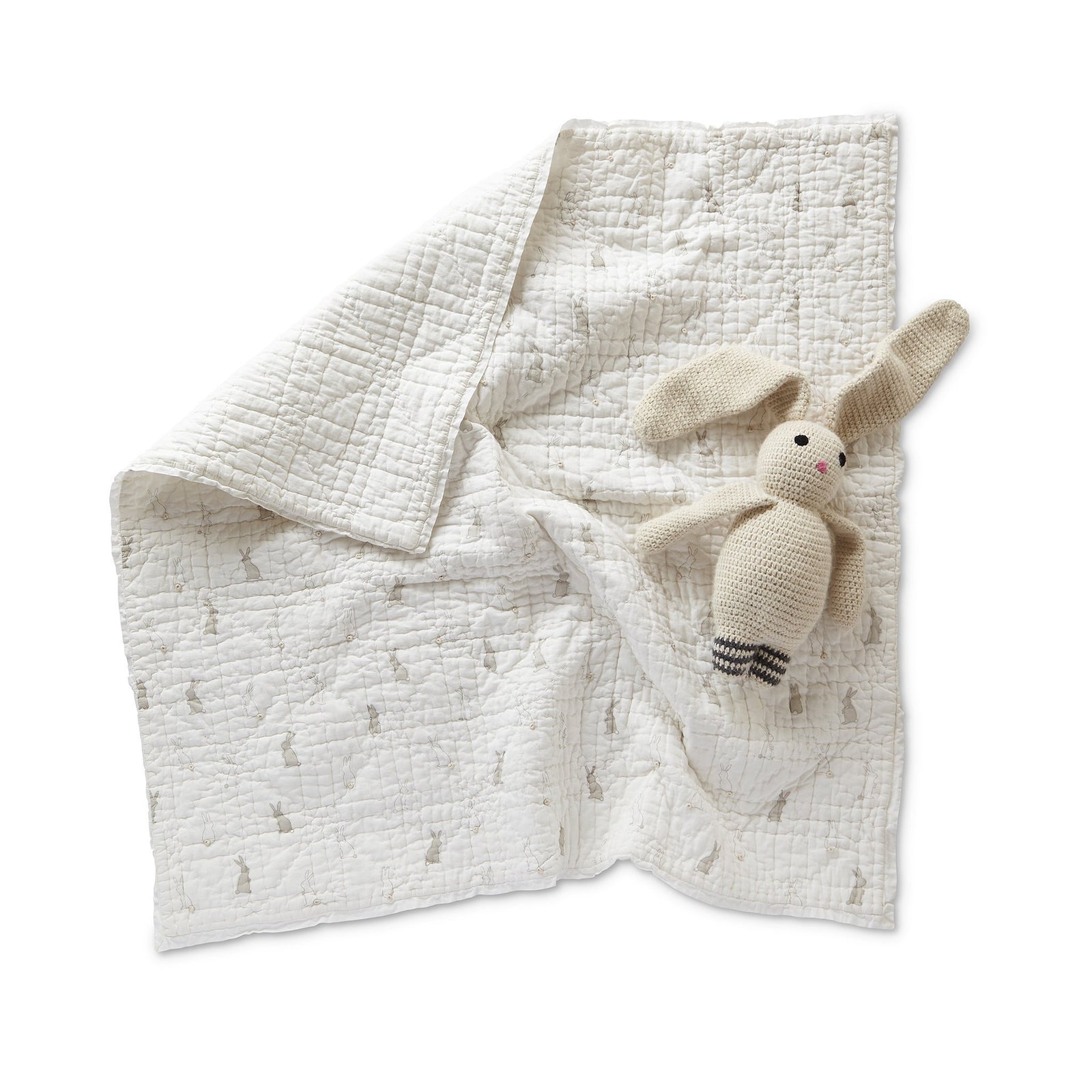 Pehr Bunny Hop Blanket with toy bunny on top. 100% cotton cambric exterior. White with bunny print.