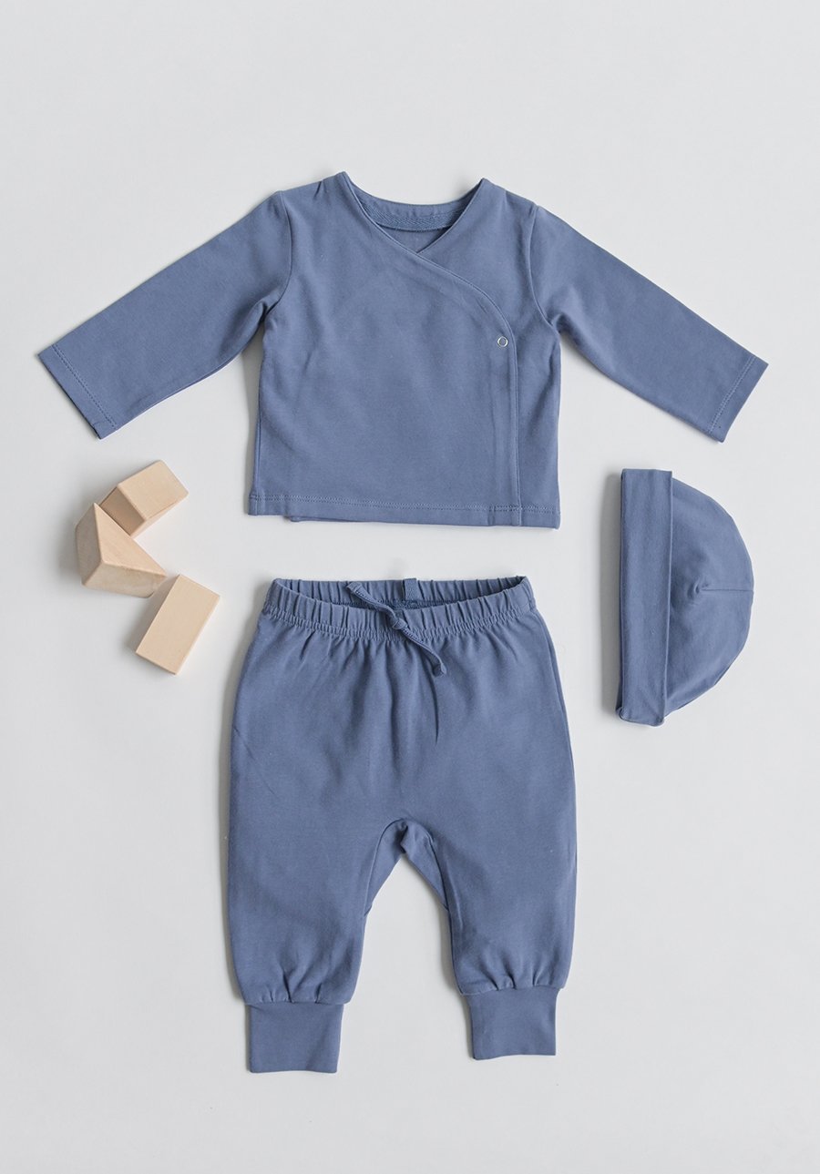 Pehr Dove Blue Essentials Pant with Pehr Dove Blue Essentials Hat and Essentials Wrap Cardigan. GOTS Certified Organic Cotton & Dyes. Mid-tone blue pants with tie.