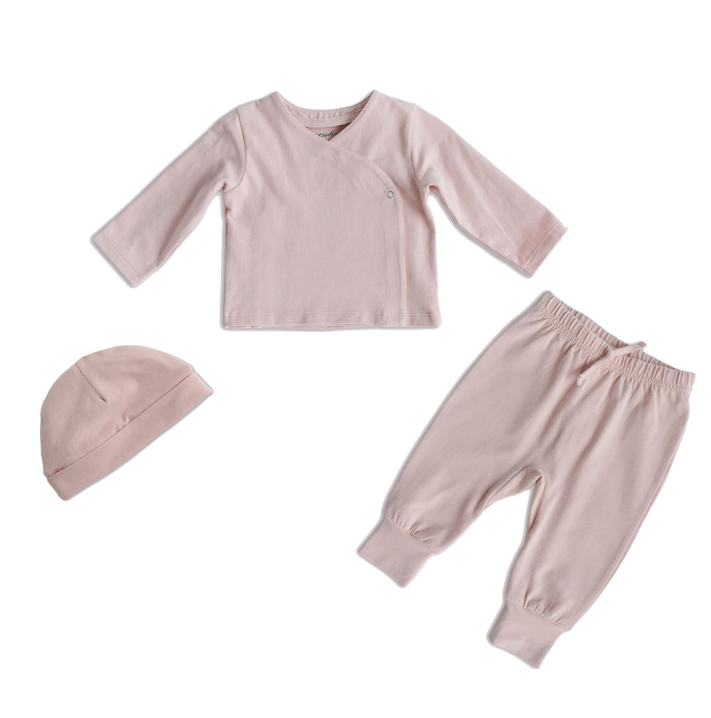 Pehr Powdered Pink 3-Piece Set. Organic. Light pink Pehr Essentials wrap cardigan, Pehr Essentials pant, and Pehr Essentials Hat.