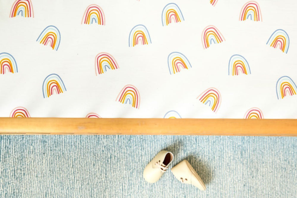 Pehr Happy Days Organic Crib Sheet. GOTS Certified Organic Cotton in crib. Screen printed by hand using AZO-Free dyes. White with colourful rainbows.