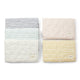 All of the Pehr Organic On The Go Travel Change Pads in Rose Pink, Deep Sea, Pebble, Marigold, and Ink Blue layered on top of each other. GOTS Certified Organic Cotton & Dyes.