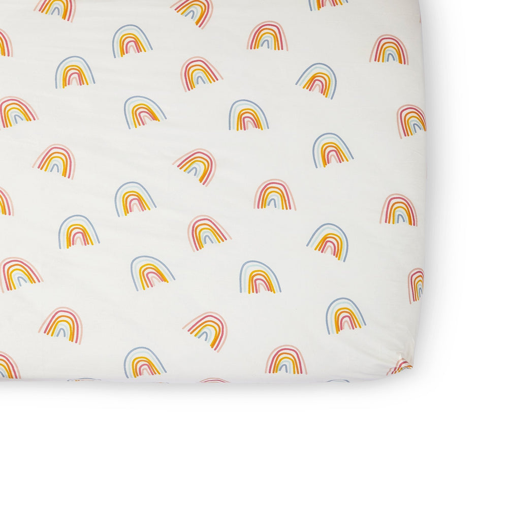Pehr Happy Days Organic Crib Sheet. GOTS Certified Organic Cotton. Screen printed by hand using AZO-Free dyes. White with colourful rainbows.