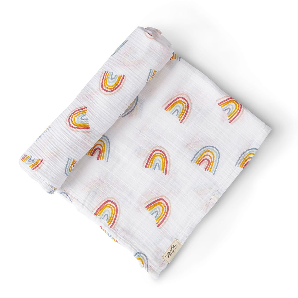 Pehr Rainbows Organic Novelty Swaddles. Organic cotton, hand printed. White with rainbow pattern.