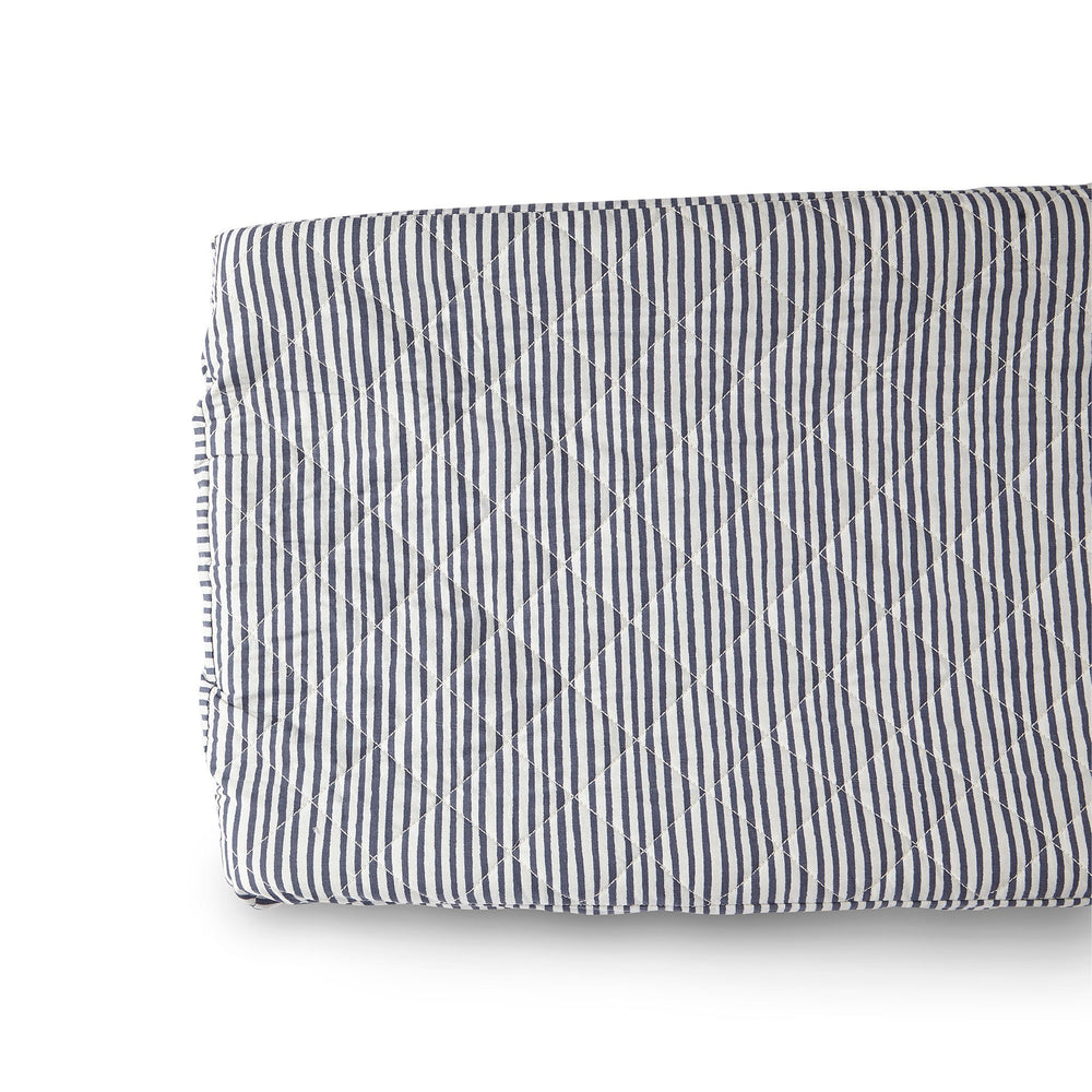 Close up of Pehr Stripes Away Ink Blue Change Pad Cover. Hand printed. White with ink blue stripes.