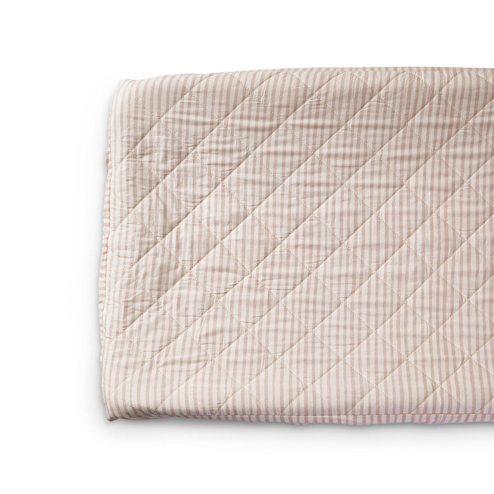 Close up of Pehr Stripes Away Petal Change Pad Cover. Hand printed. White with light pink stripes.