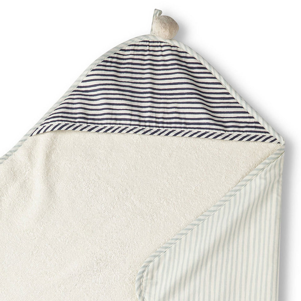 Pehr Stripes Away Sea Hooded Towel. Hand printed. Cotton. White with light blue and dark blue stripes, terry cloth inside.