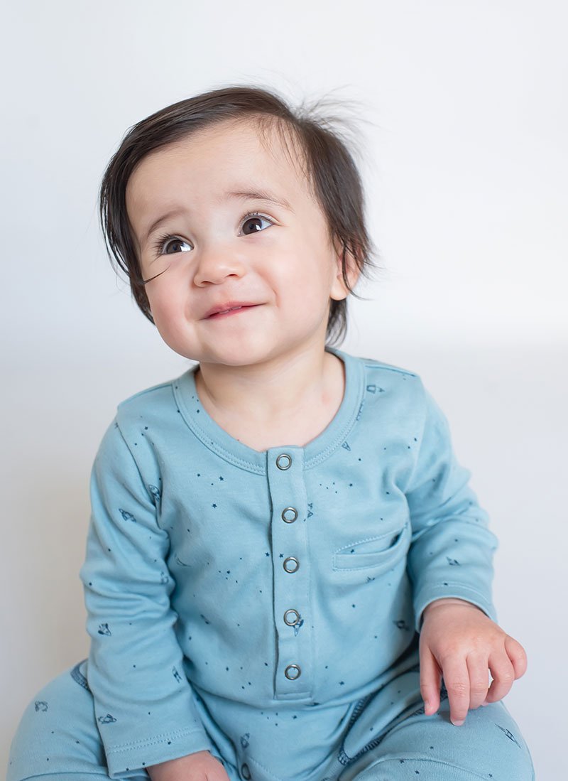 Pehr Long Sleeve Rocketman Romper. Certified organic cotton. Blue with rocket-ships.