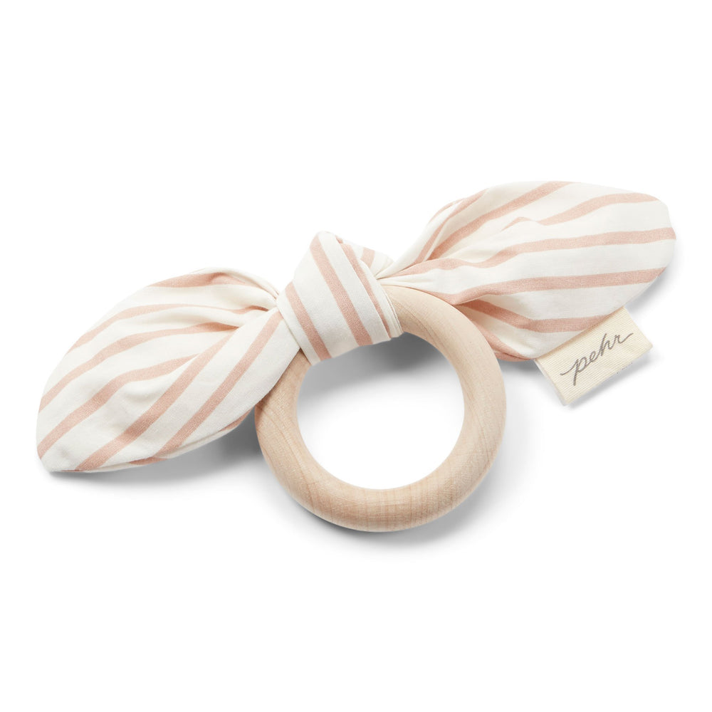 Pehr Rose Pink Organic On the Go Teether. GOTS Certified Organic Cotton & Dyes. White bow with light pink stripes, maple wood ring.
