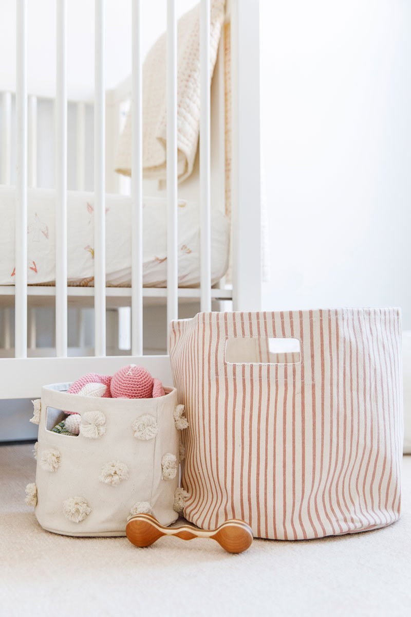 Pehr Printed Bin Stripes Away Petal Hamper. Handmade. Round canvas with pink stripes in baby nursery.